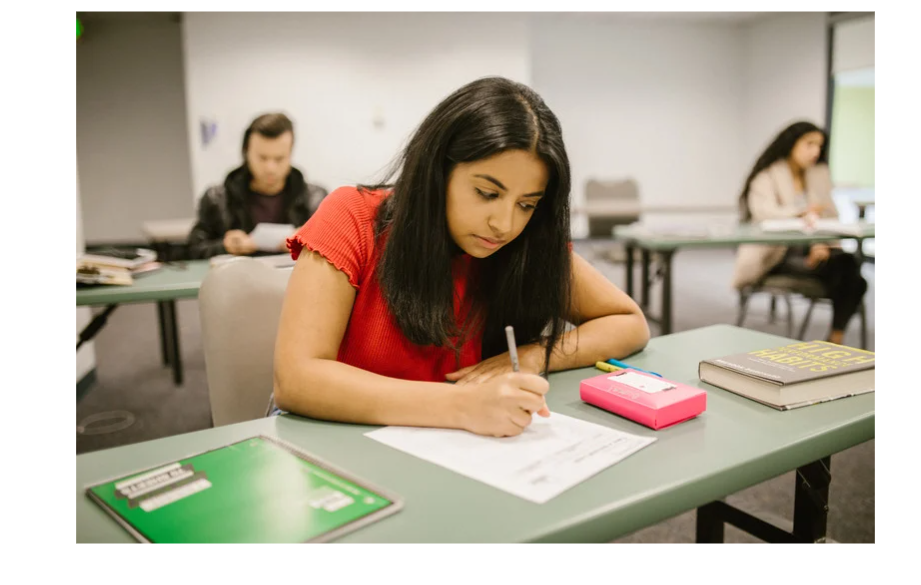 A young girl writing exam